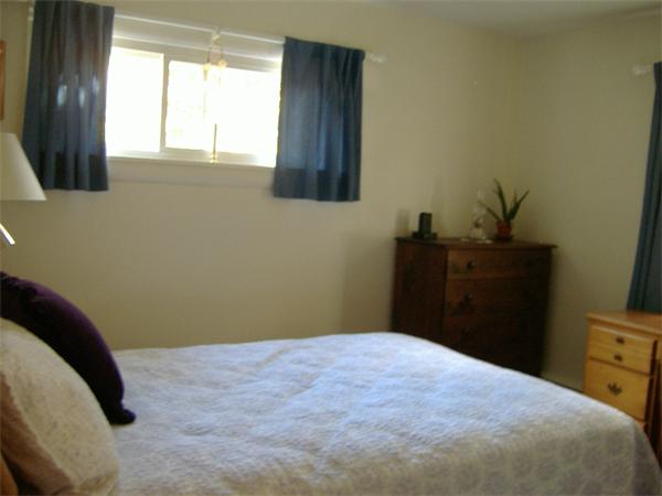 61 Hollis Road Lunenburg, MA 01462 - Photo 16 of 27 a bedroom with a bed and a window