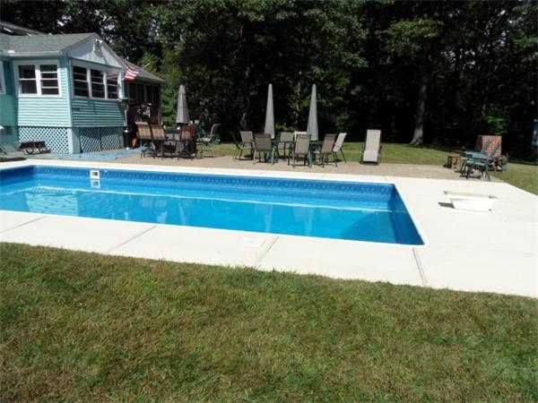 61 Hollis Road Lunenburg, MA 01462 - Photo 22 of 27 a view of a house with a swimming pool