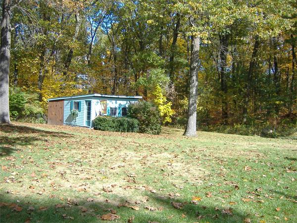 61 Hollis Road Lunenburg, MA 01462 - Photo 23 of 27 a front view of a house with a yard