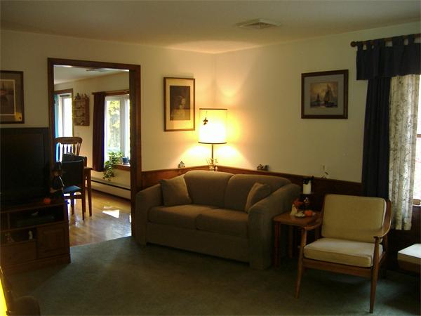 61 Hollis Road Lunenburg, MA 01462 - Photo 10 of 27 a living room with furniture and a couch
