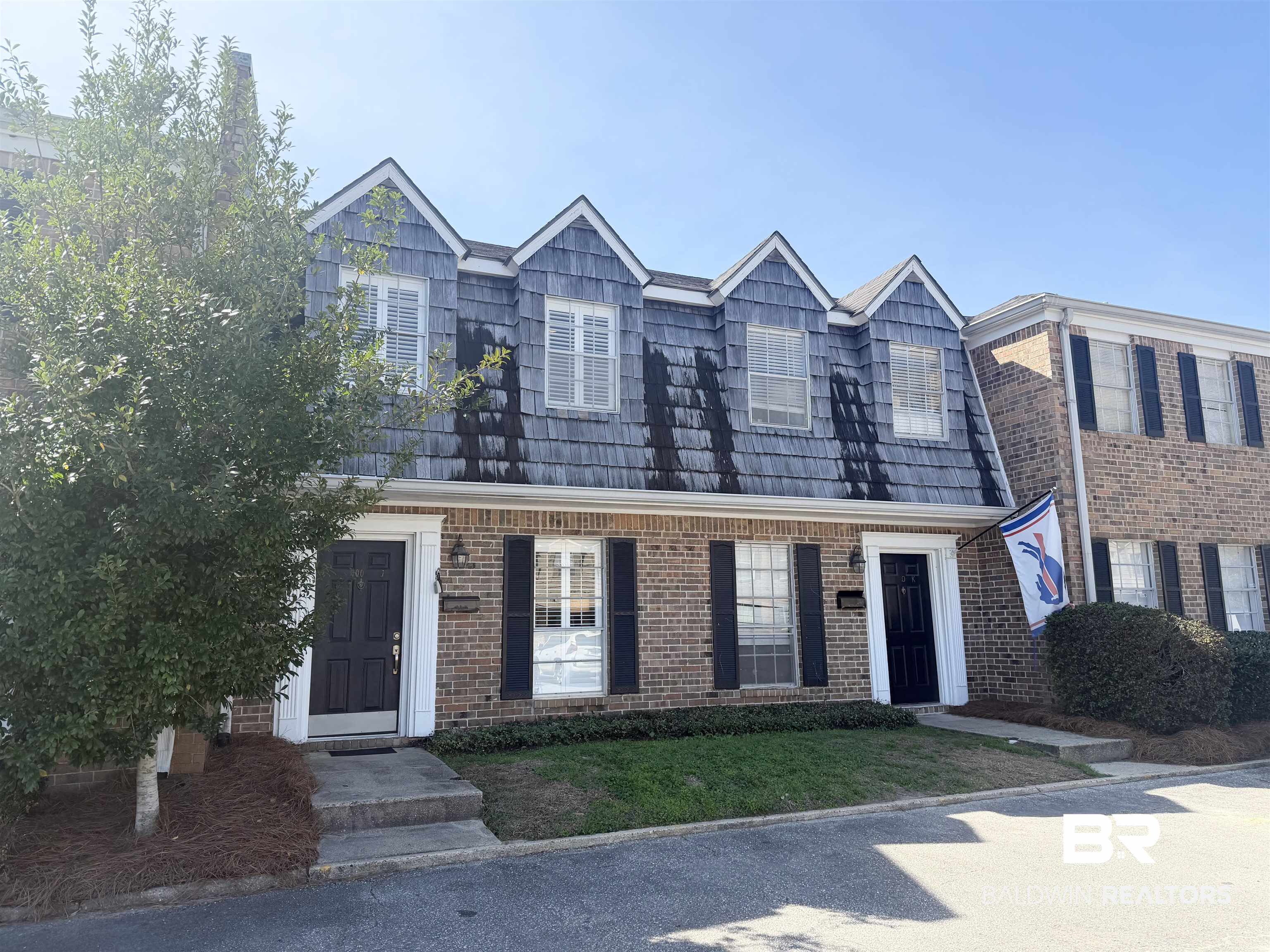 100 Du Rhu Drive, Unit J Mobile, AL 36608 - Photo 2 of 17 View of front of home featuring brick siding