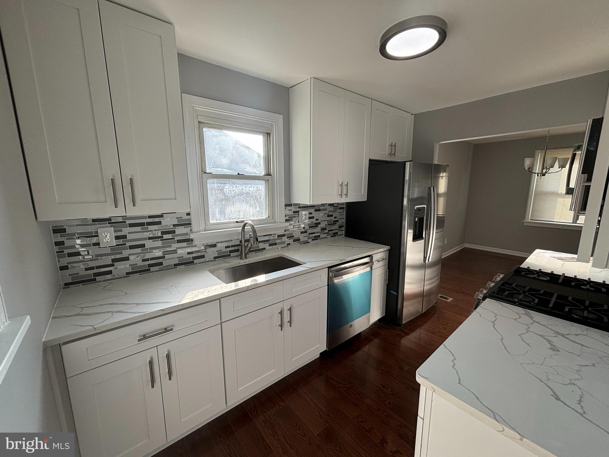2507 Mason Street Silver Spring, MD 20902 - Photo 14 of 49 a kitchen with a sink stove and refrigerator