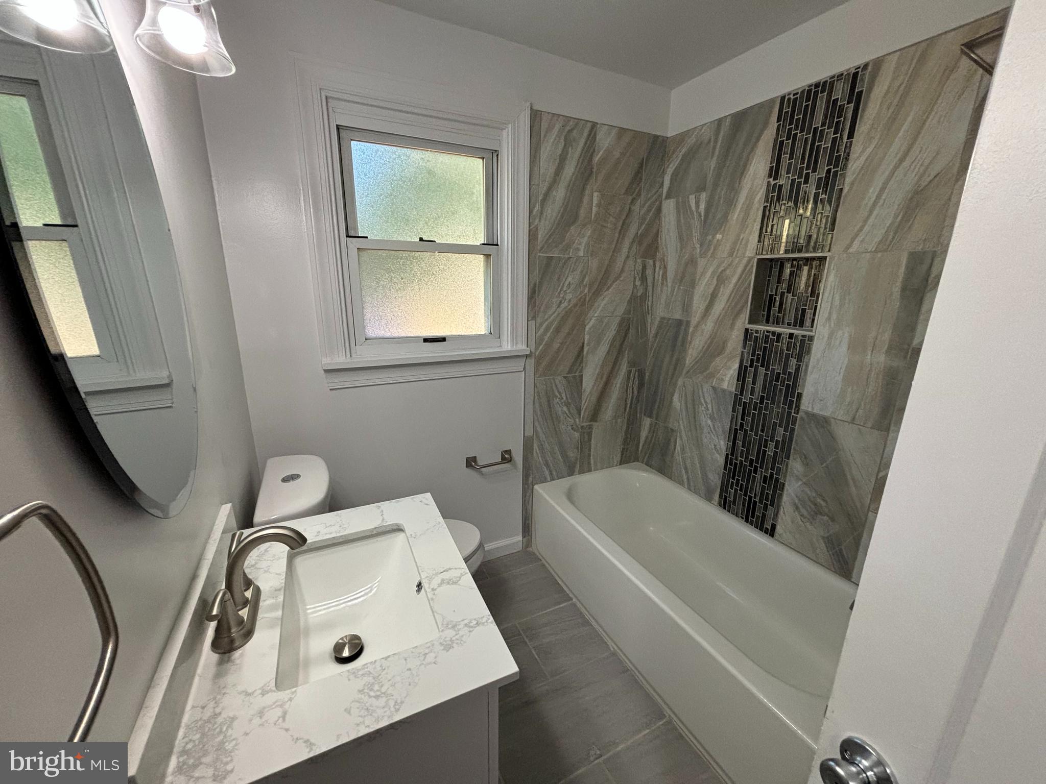 2507 Mason Street Silver Spring, MD 20902 - Photo 18 of 49 a bathroom with a sink a toilet and shower
