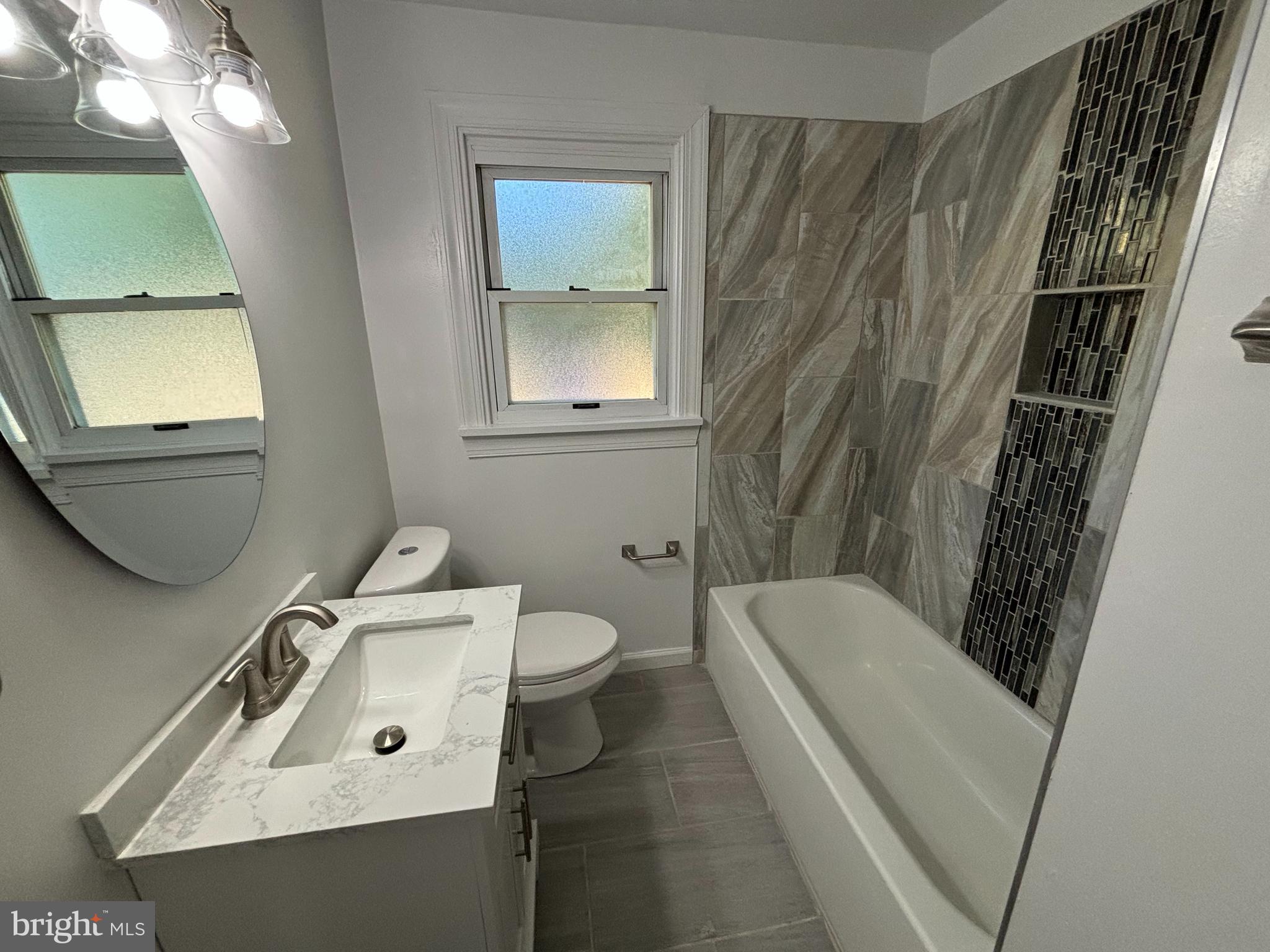 2507 Mason Street Silver Spring, MD 20902 - Photo 19 of 49 a bathroom with a sink a toilet and shower