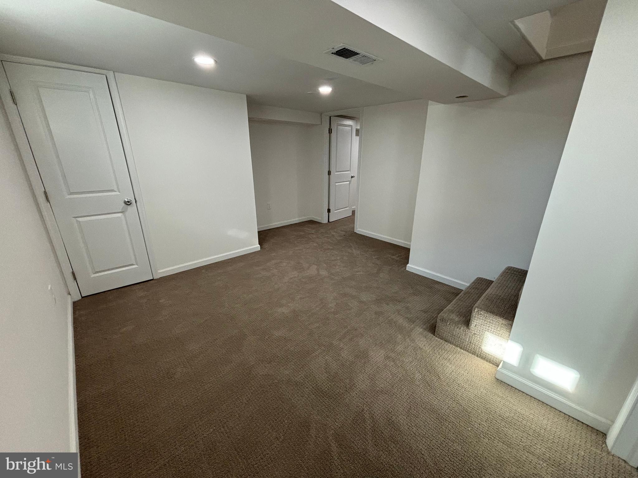 2507 Mason Street Silver Spring, MD 20902 - Photo 34 of 49 an empty room with wooden floor and windows