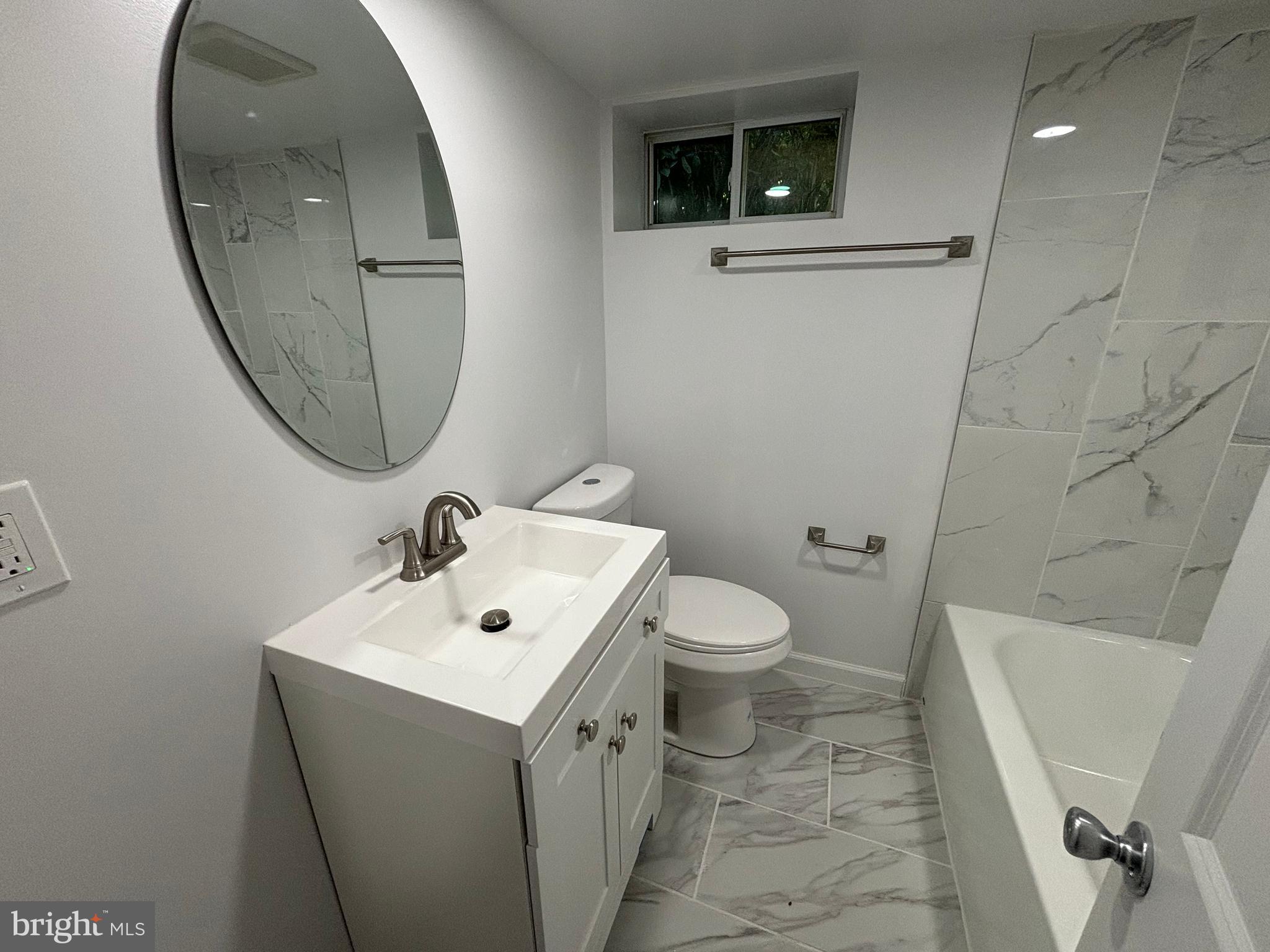 2507 Mason Street Silver Spring, MD 20902 - Photo 38 of 49 a bathroom with a sink mirror and toilet