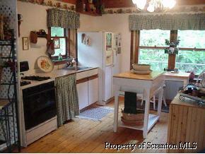 0 Creamery Road Montrose, PA 18801 - Photo 3 of 5 a open kitchen with stainless steel appliances granite countertop a stove a sink and a microwave