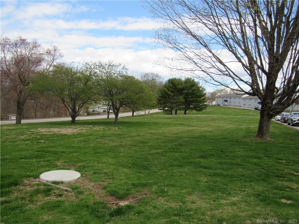 83 Horse Pond Road, Unit B Salem, CT 06420 - Photo 12 of 13 a view of grassy field with benches