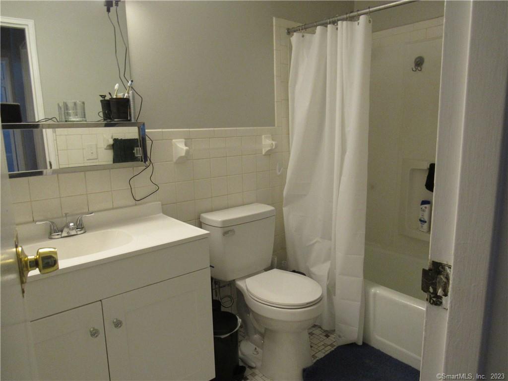 83 Horse Pond Road, Unit B Salem, CT 06420 - Photo 7 of 13 a bathroom with a sink a toilet and shower