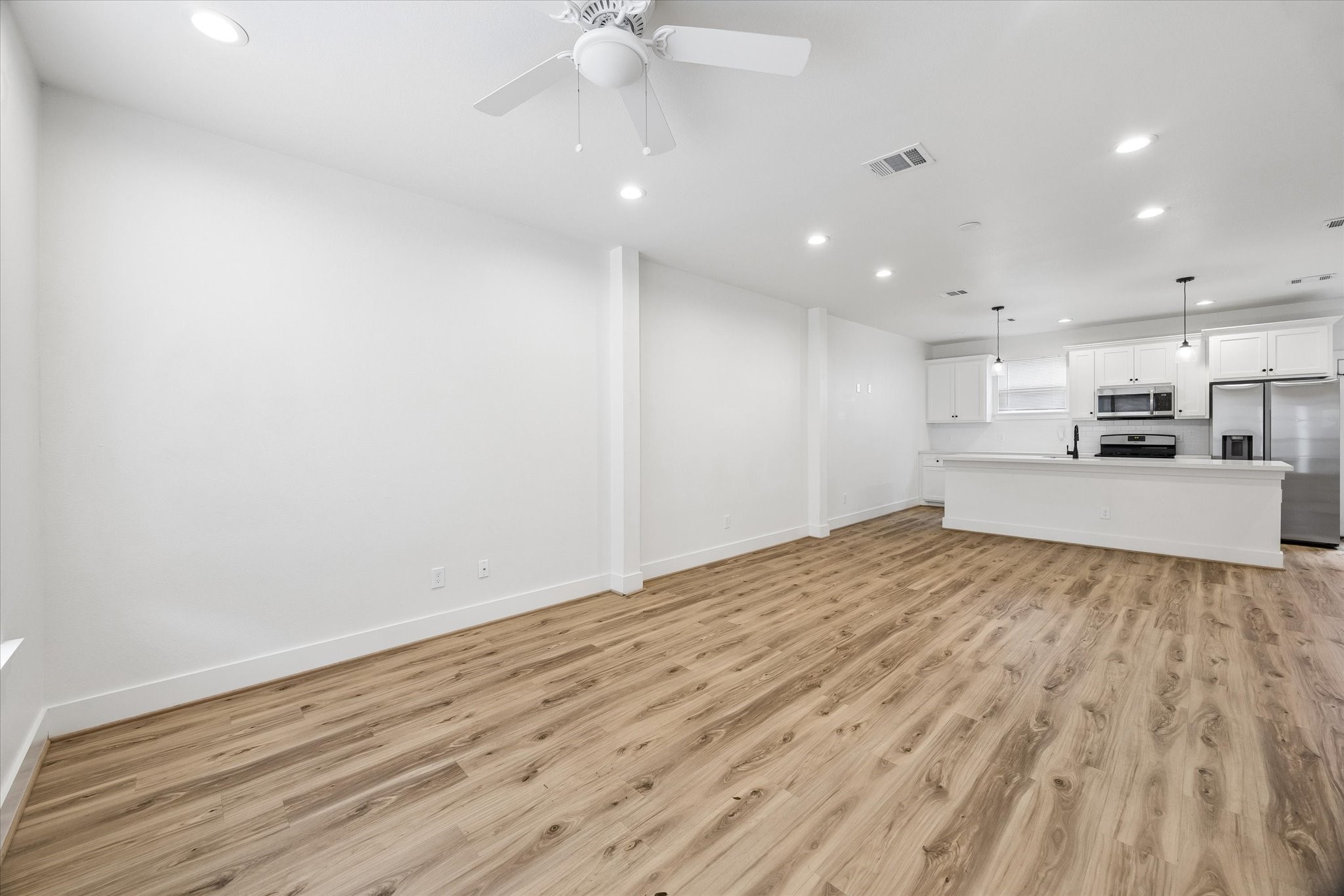 2749 Redrock Street, Unit B Houston, TX 77088 - Photo 3 of 24 Luxury vinyl plank hardwood flooring is throughout the home.