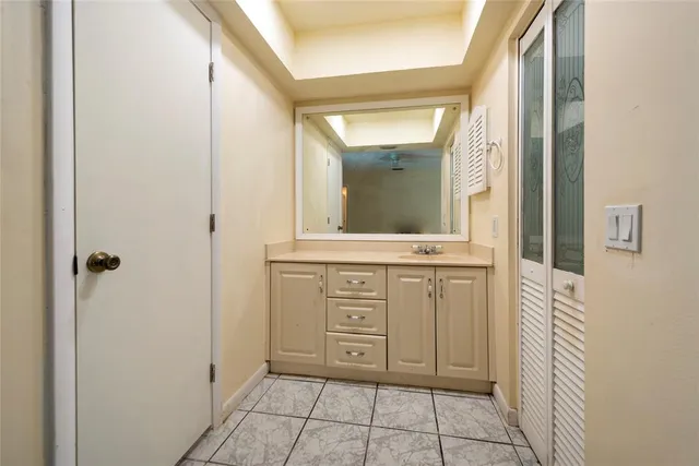 a white toilet sitting next to a bathroom sink