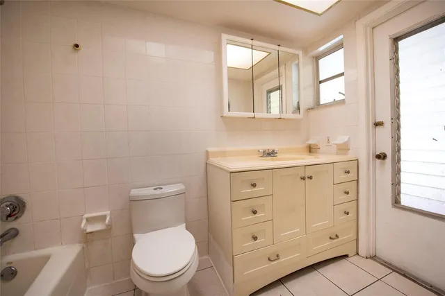 a view of swimming pool with deck and garden