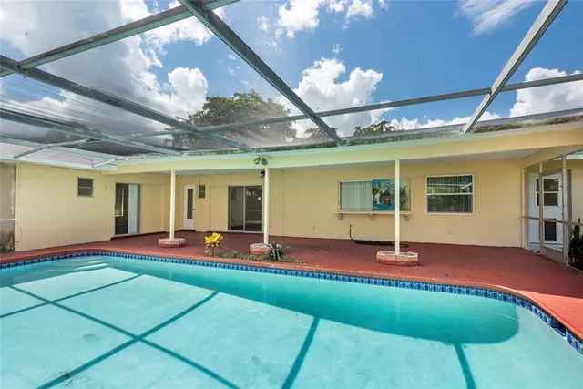 a view of a swimming pool with a porch