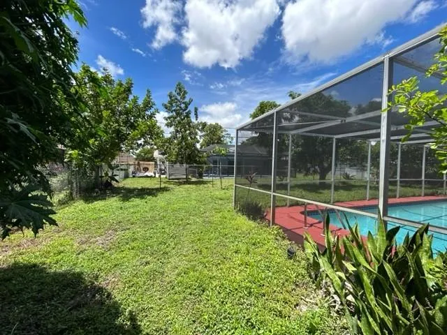 a view of a backyard with a garden and plants