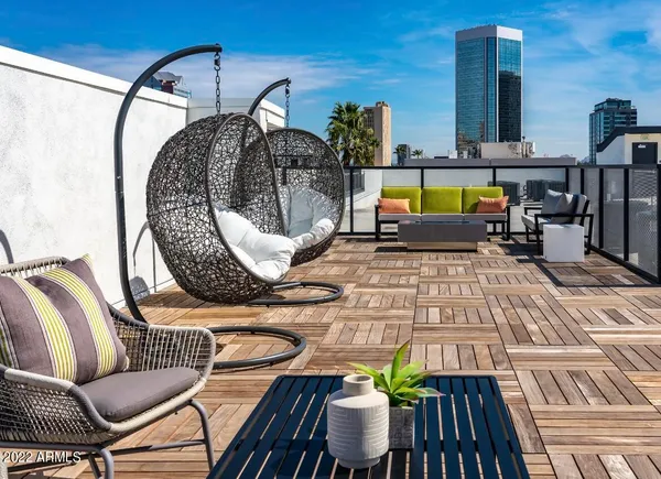 a view of a balcony with chairs