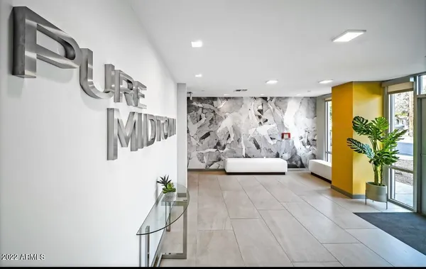 a view of a livingroom with furniture and a window