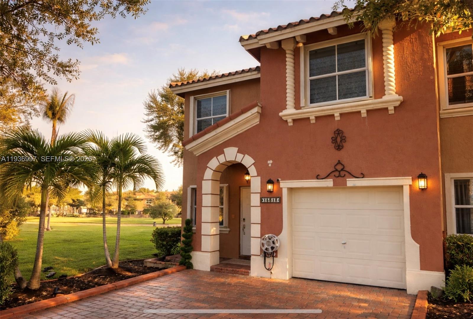 15313 Southwest 31st Terrace, Unit 15313 Miami, FL 33185 - Photo 1 of 21 a house view with a garden space