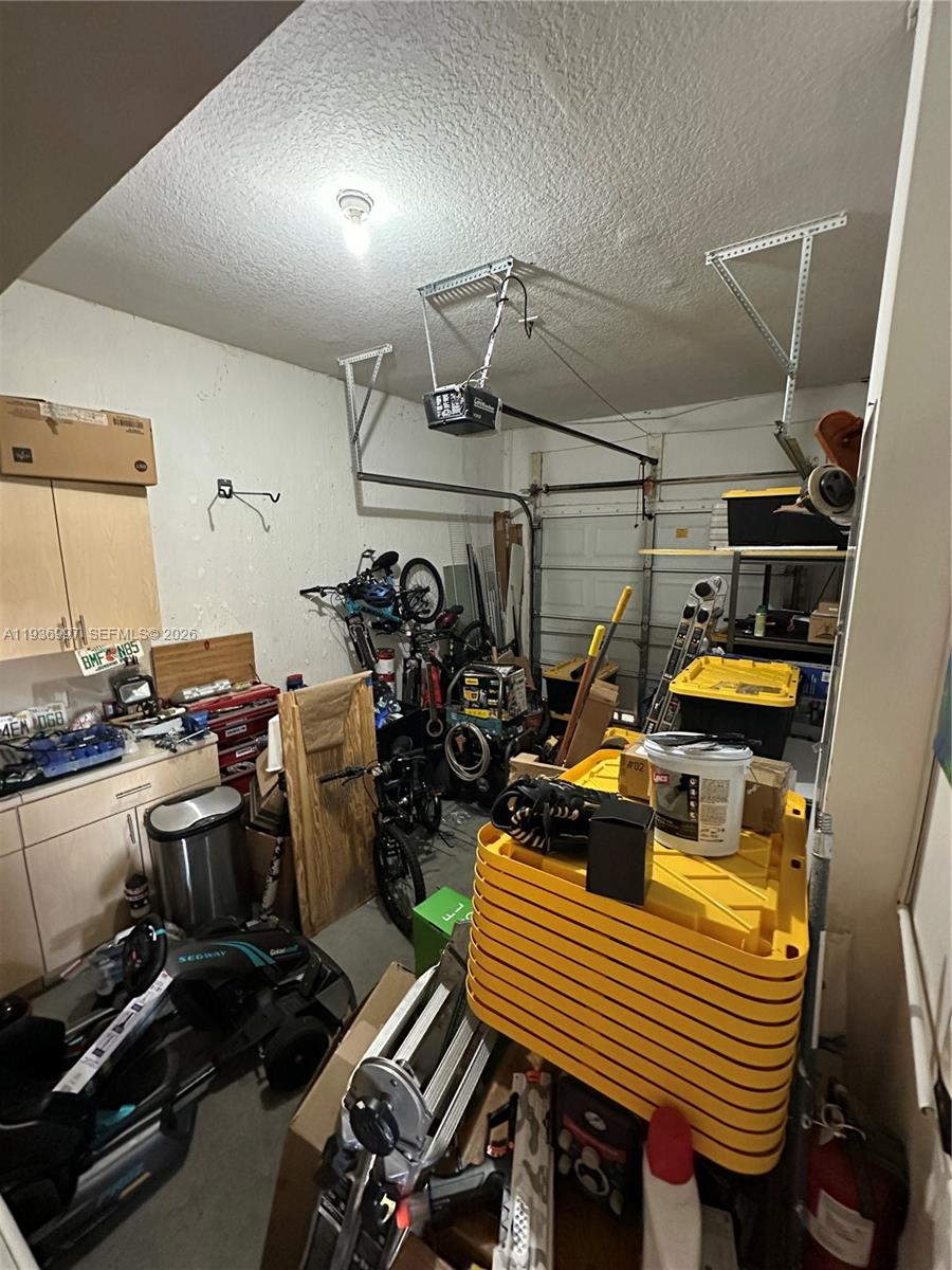 15313 Southwest 31st Terrace, Unit 15313 Miami, FL 33185 - Photo 17 of 21 a view of a room with gym equipment