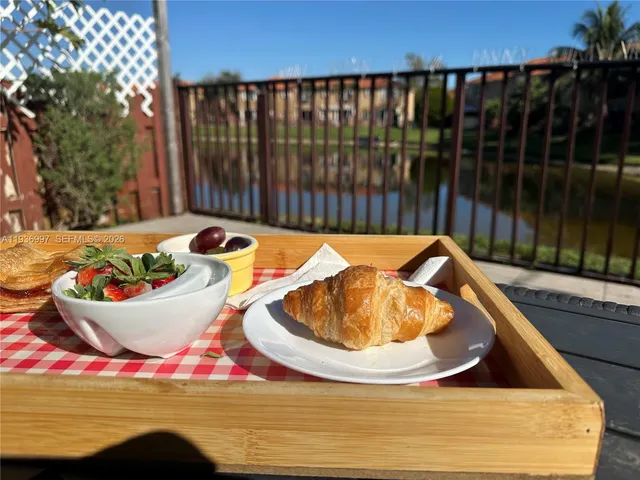 a view of a swimming pool with an outdoor seating