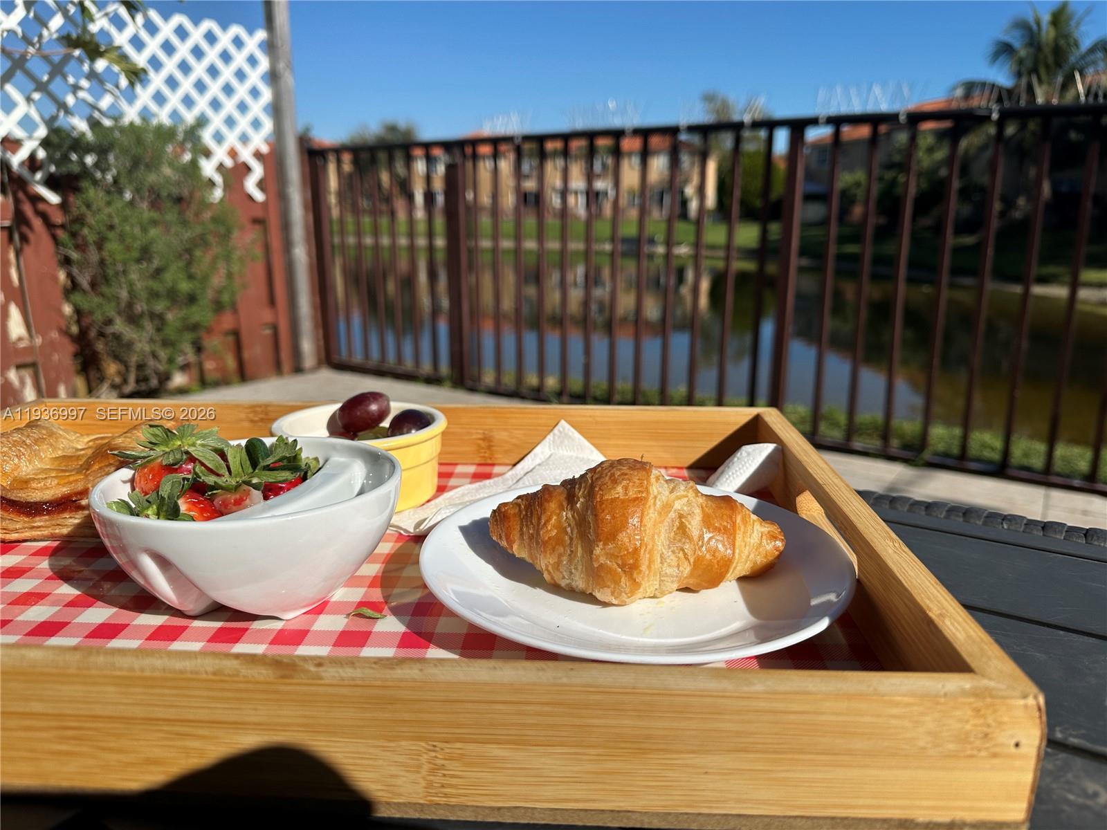 15313 Southwest 31st Terrace, Unit 15313 Miami, FL 33185 - Photo 18 of 21 a view of a swimming pool with an outdoor seating