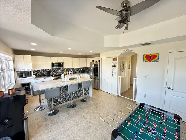 a large room with gym equipment