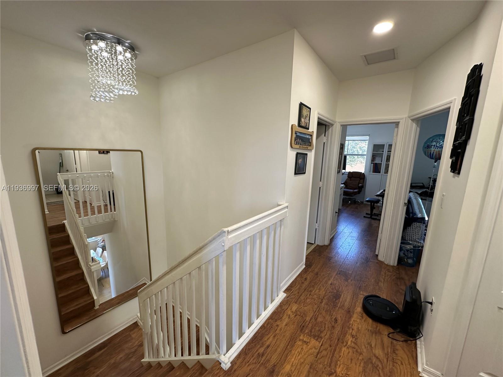 15313 Southwest 31st Terrace, Unit 15313 Miami, FL 33185 - Photo 10 of 21 a view of entryway and hall with wooden floor