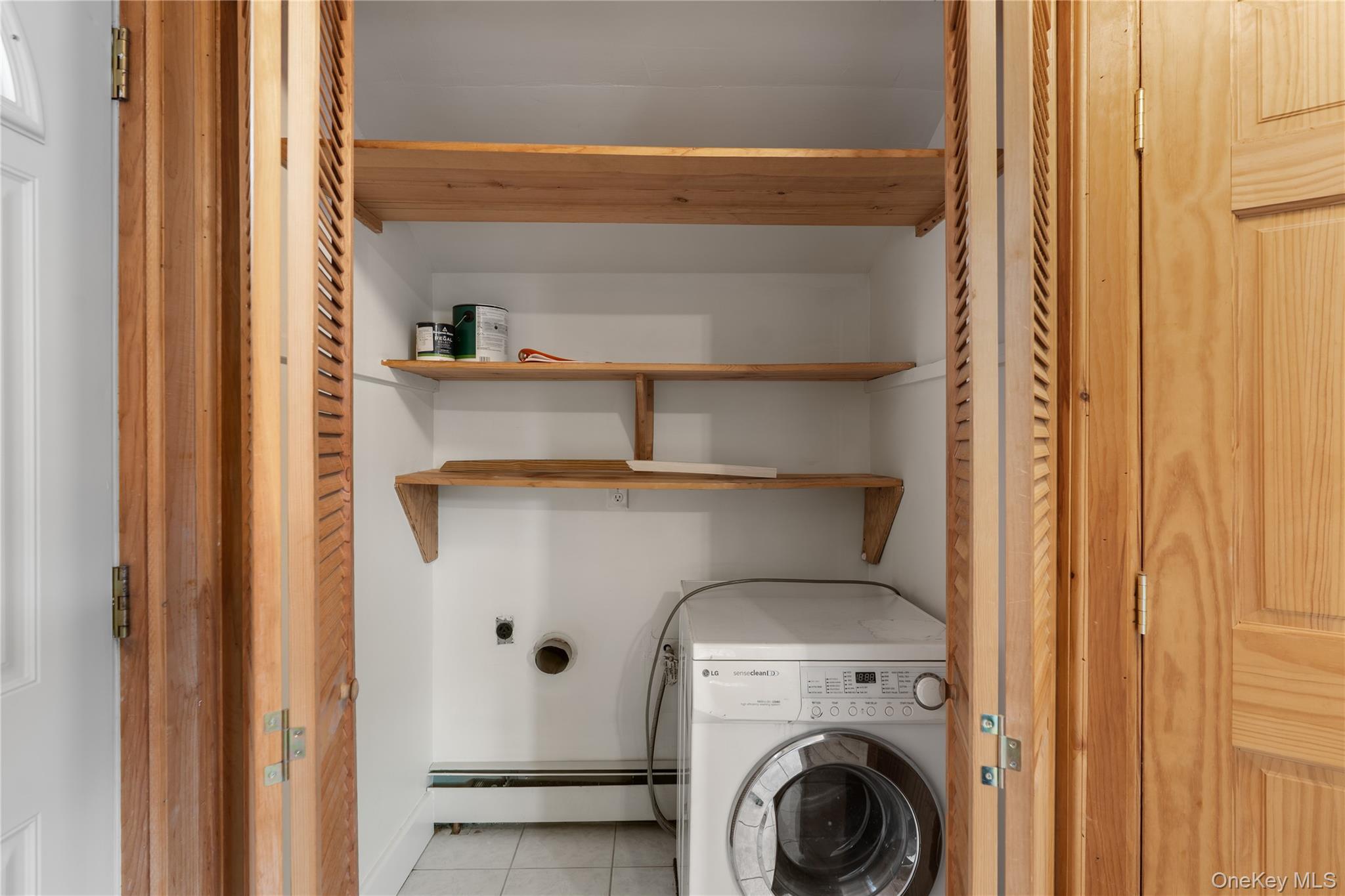 Undisclosed Address Middletown, NY 10940 - Photo 11 of 24 a close view of cabinet and washer