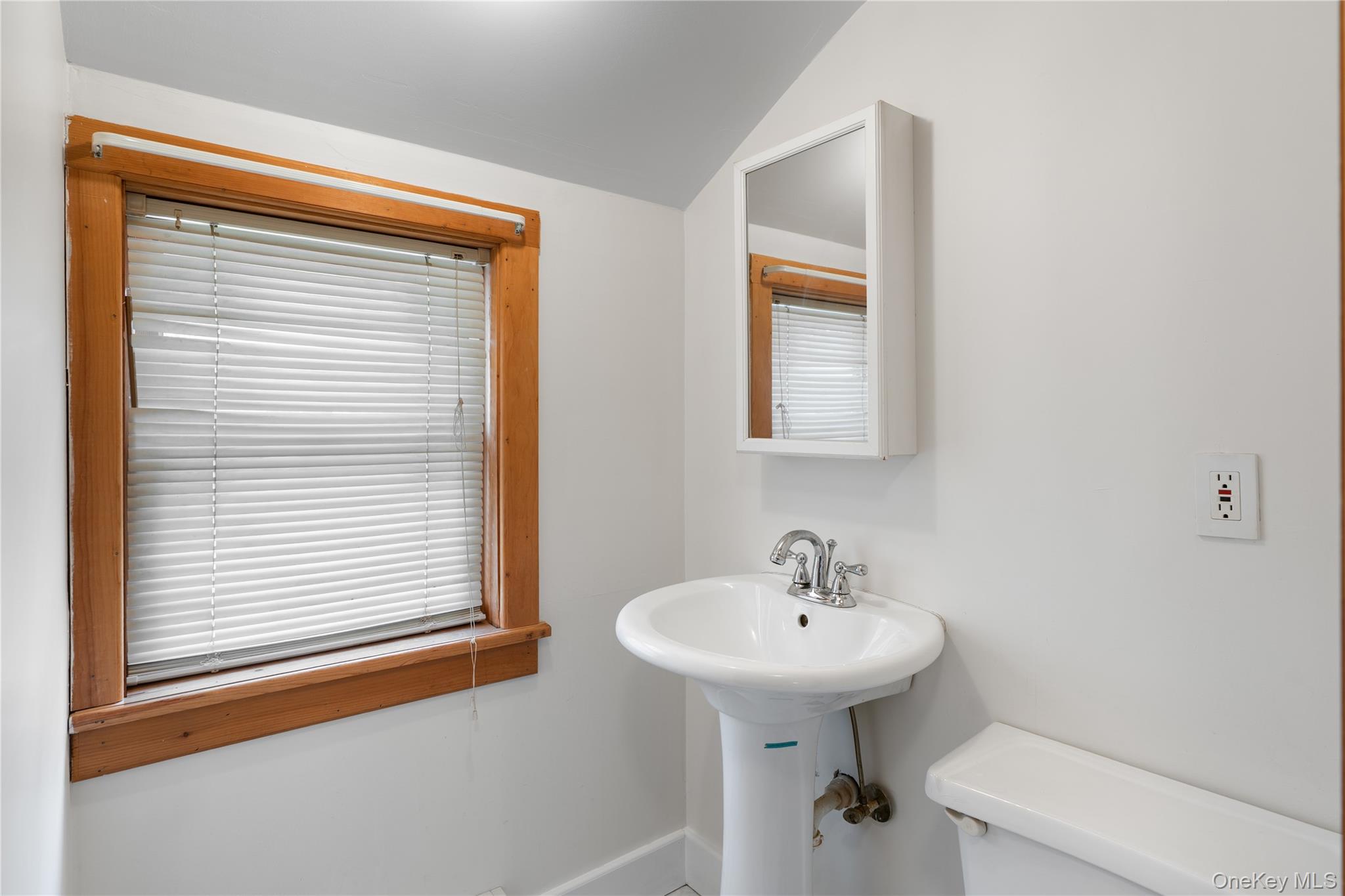 Undisclosed Address Middletown, NY 10940 - Photo 12 of 24 a bathroom with a sink a mirror and a toilet