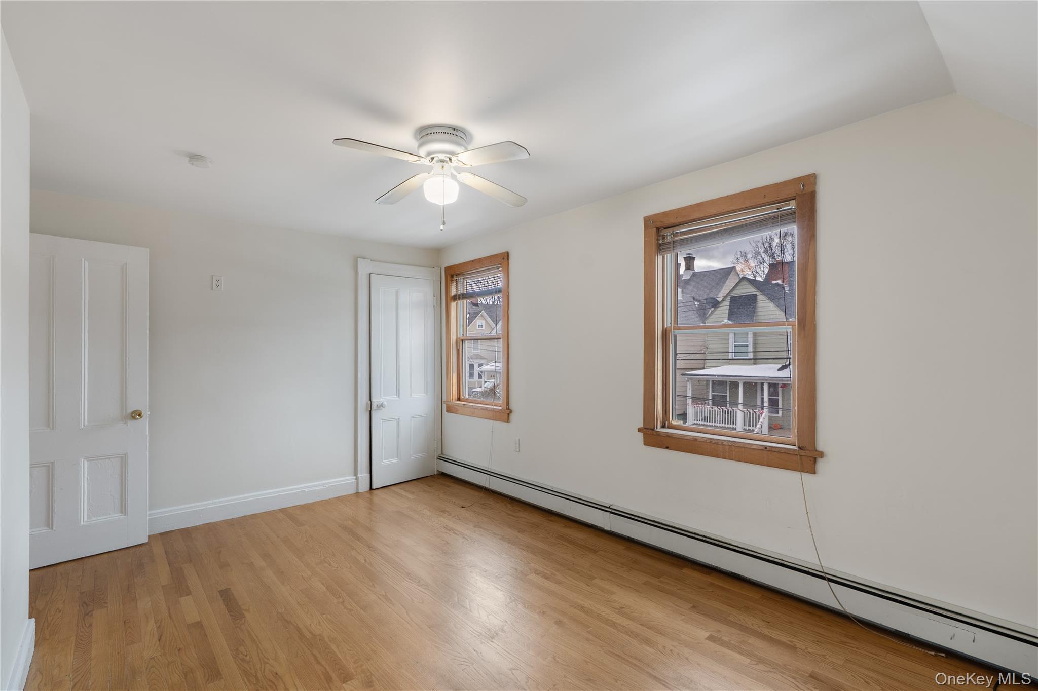 Undisclosed Address Middletown, NY 10940 - Photo 14 of 24 a view of empty room with wooden floor and fan
