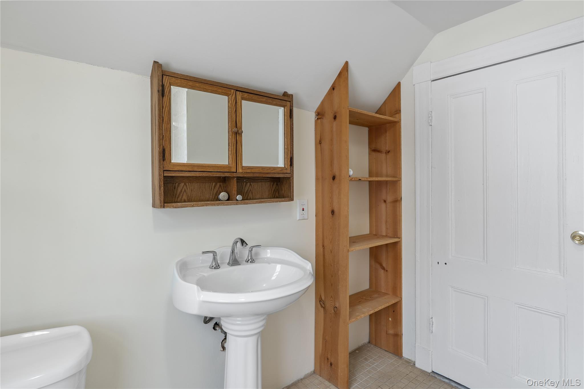 Undisclosed Address Middletown, NY 10940 - Photo 20 of 24 a bathroom with a sink a toilet and a mirror
