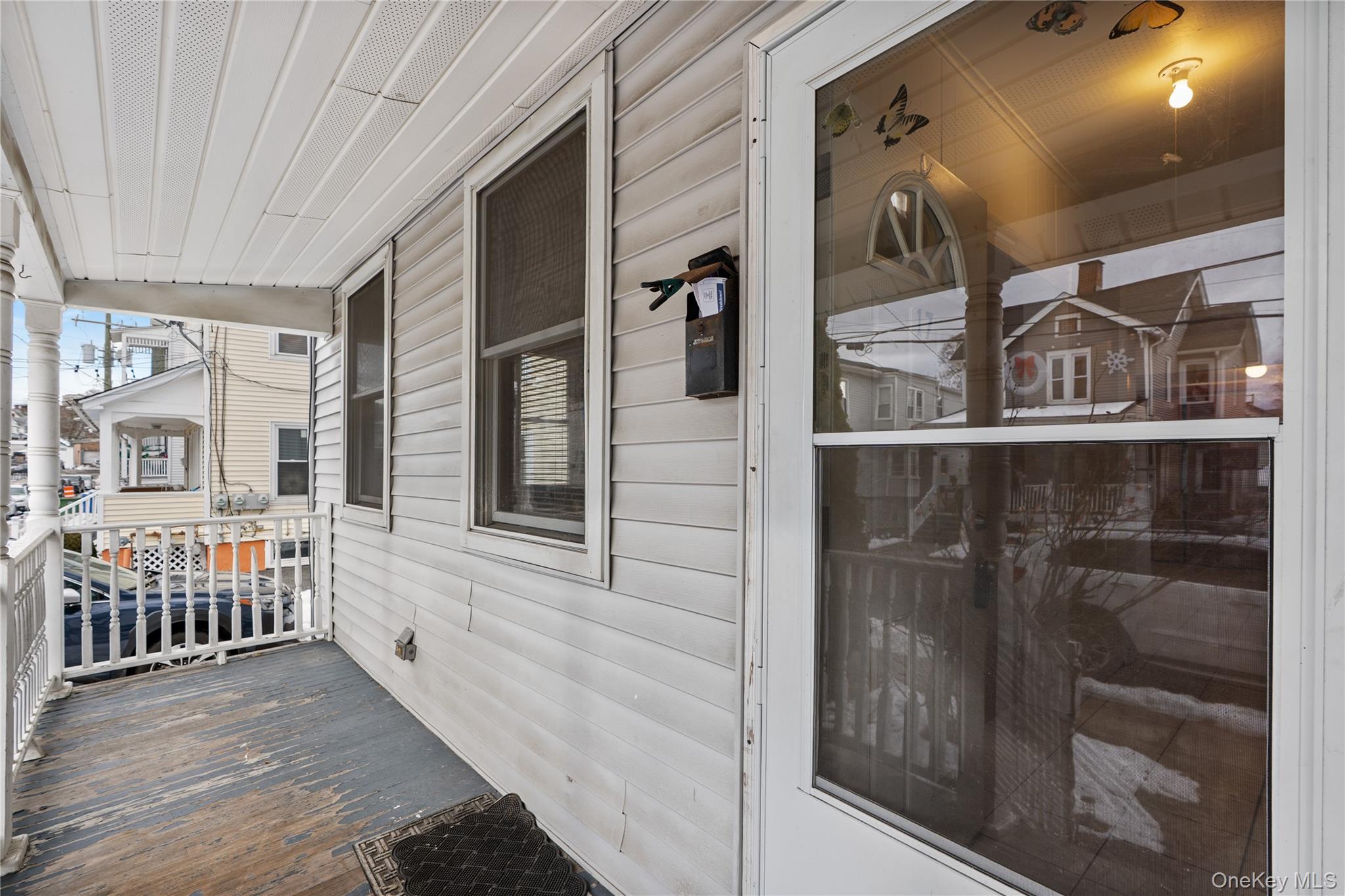 Undisclosed Address Middletown, NY 10940 - Photo 2 of 24 a view of an entryway with wooden floor and door