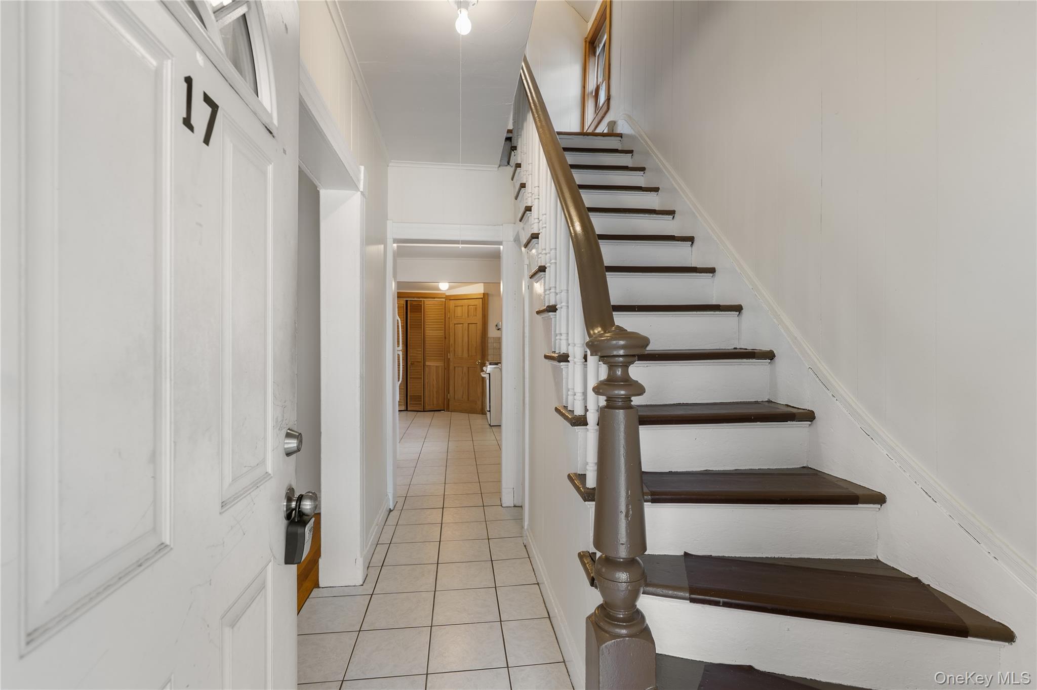 Undisclosed Address Middletown, NY 10940 - Photo 3 of 24 a view of hallway with stairs and wooden floor