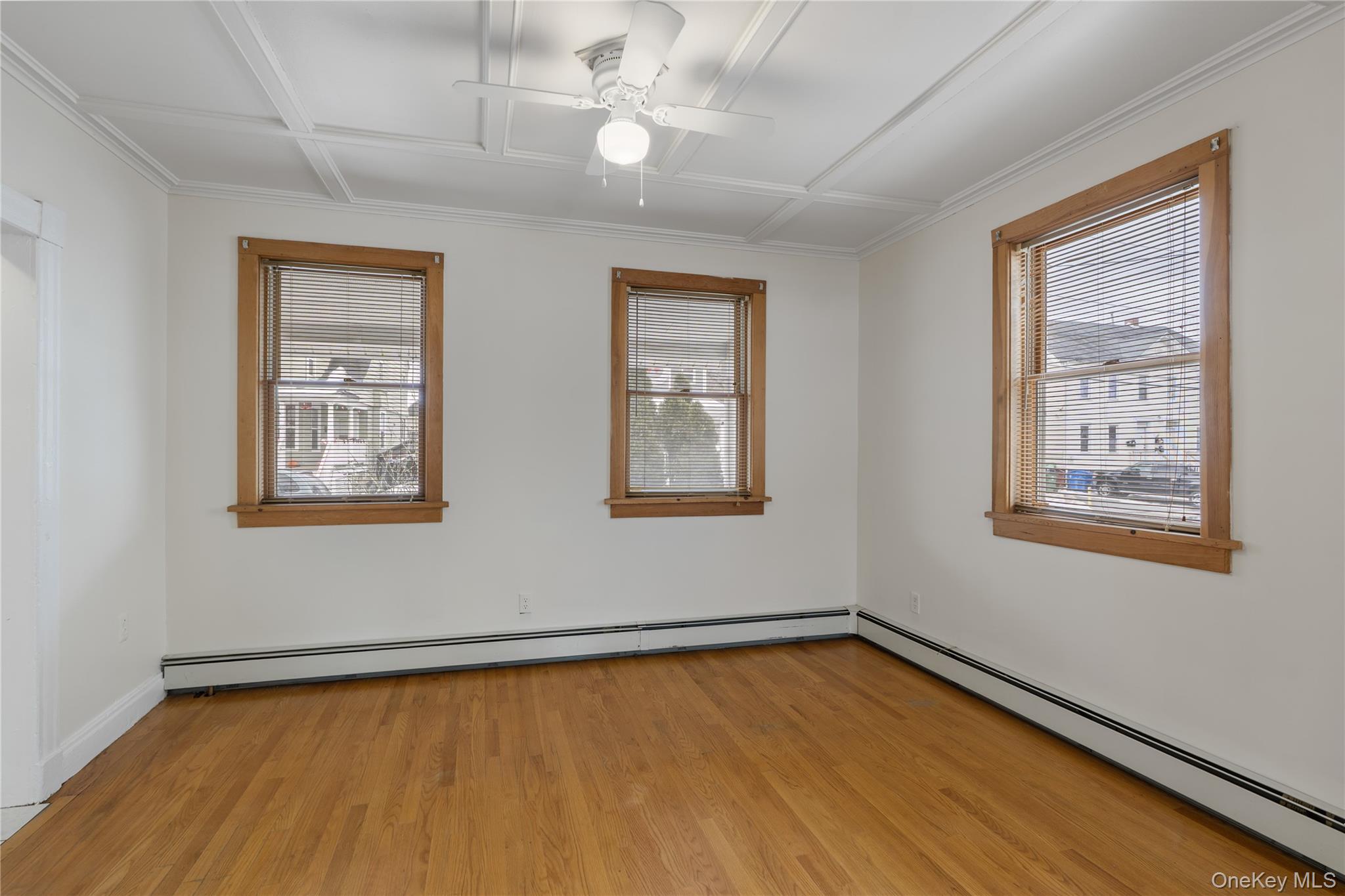 Undisclosed Address Middletown, NY 10940 - Photo 6 of 24 a view of an empty room with a window and wooden floor
