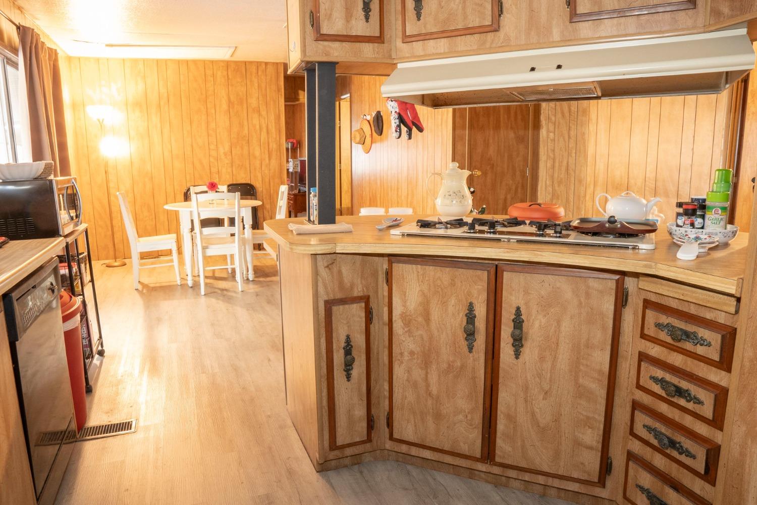 1500 Villa Avenue, Unit 117 Clovis, CA 93612 - Photo 13 of 31 a view of a living room with furniture and floor to ceiling windows