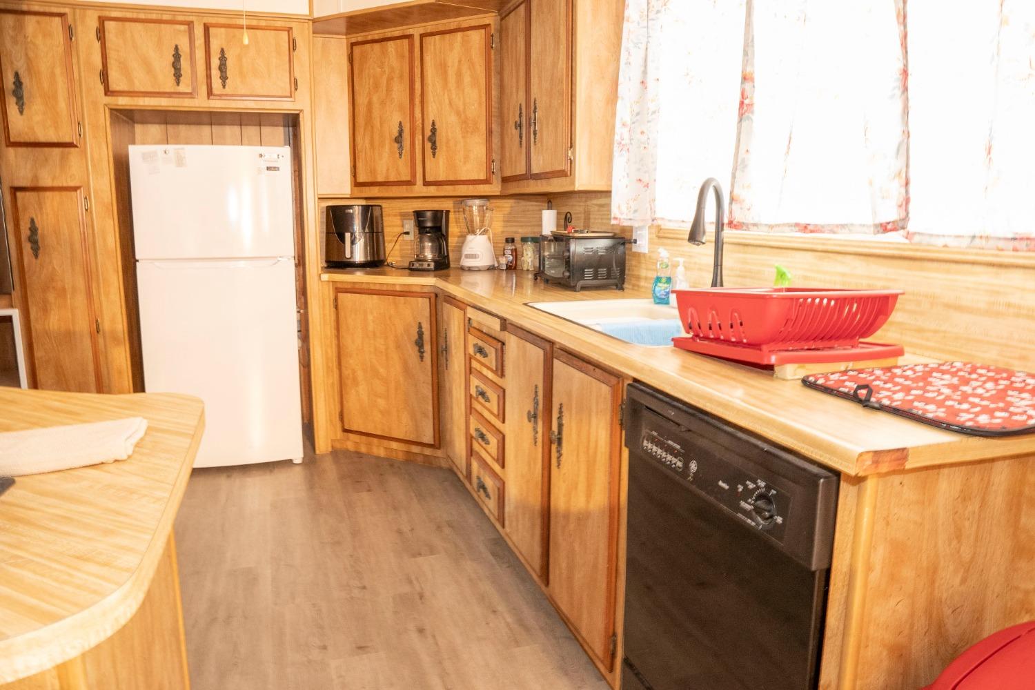 1500 Villa Avenue, Unit 117 Clovis, CA 93612 - Photo 14 of 31 a kitchen with a sink and a refrigerator