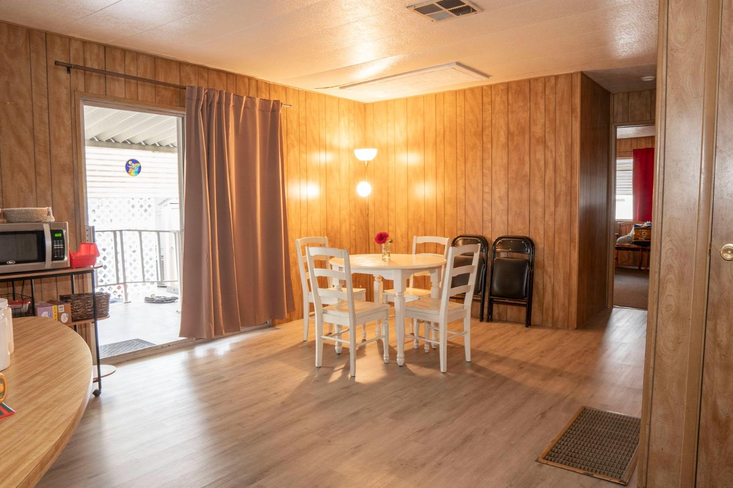 1500 Villa Avenue, Unit 117 Clovis, CA 93612 - Photo 16 of 31 a view of a dining room with furniture and a window