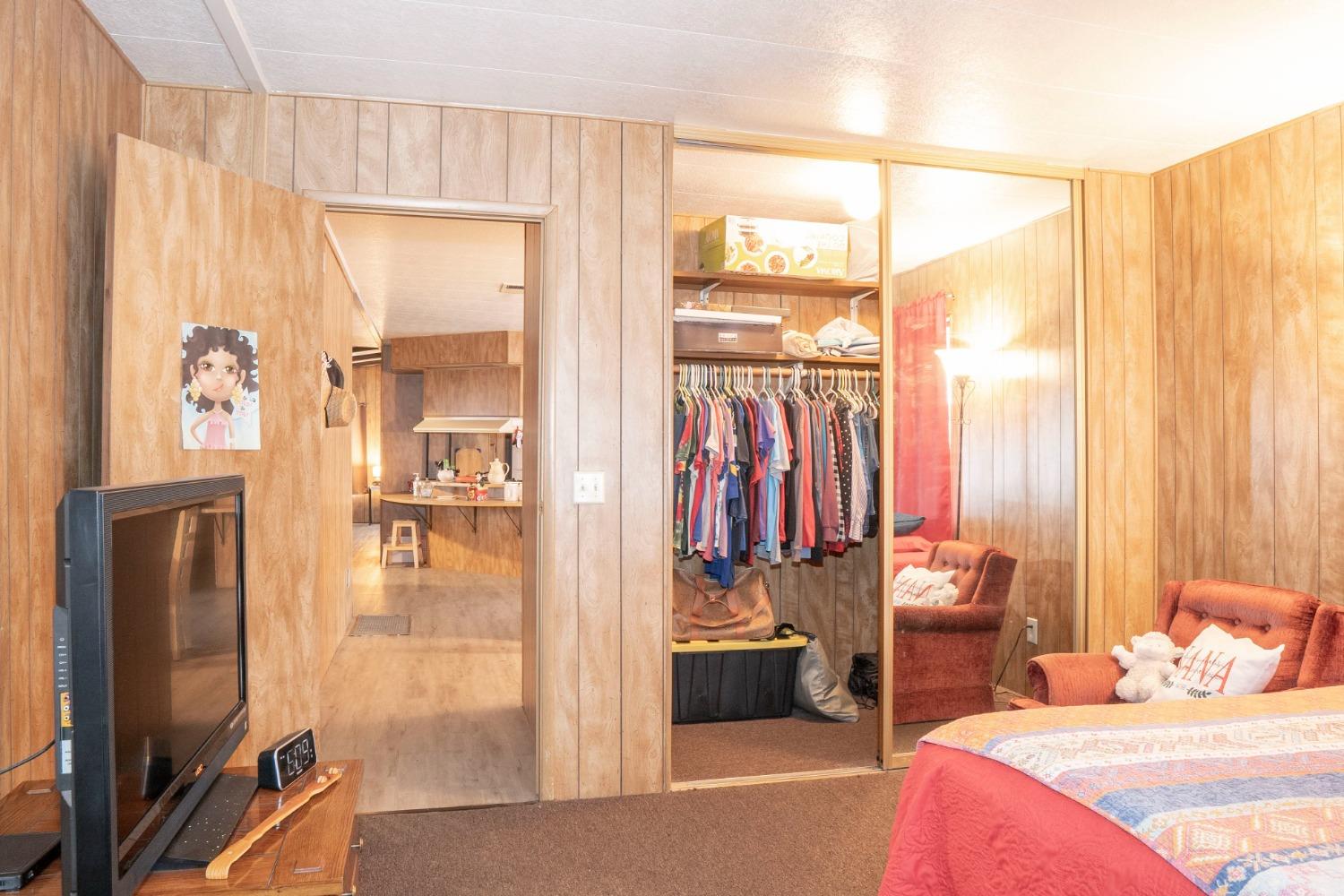 1500 Villa Avenue, Unit 117 Clovis, CA 93612 - Photo 20 of 31 a bedroom with a bed and large windows