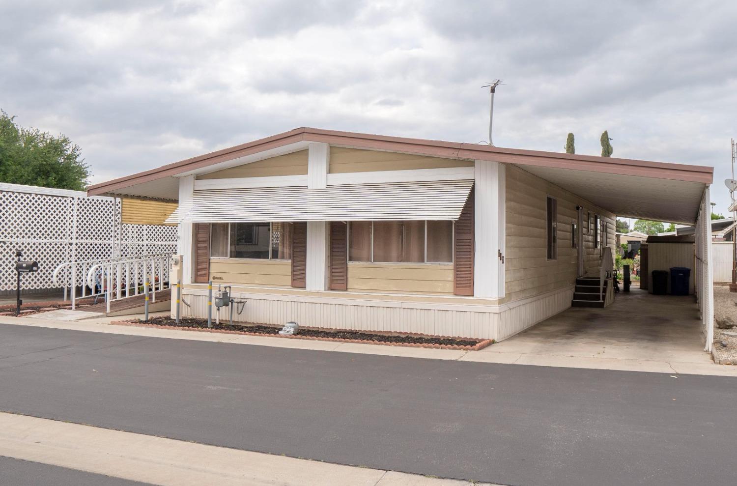 1500 Villa Avenue, Unit 117 Clovis, CA 93612 - Photo 2 of 31 a front view of a house with a garage