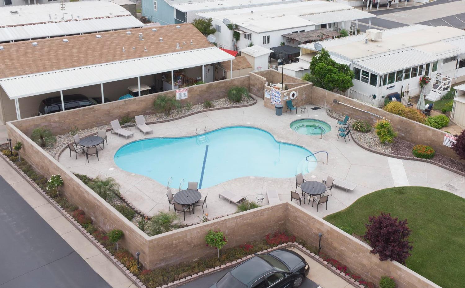 1500 Villa Avenue, Unit 117 Clovis, CA 93612 - Photo 29 of 31 a balcony with couple of cars parked