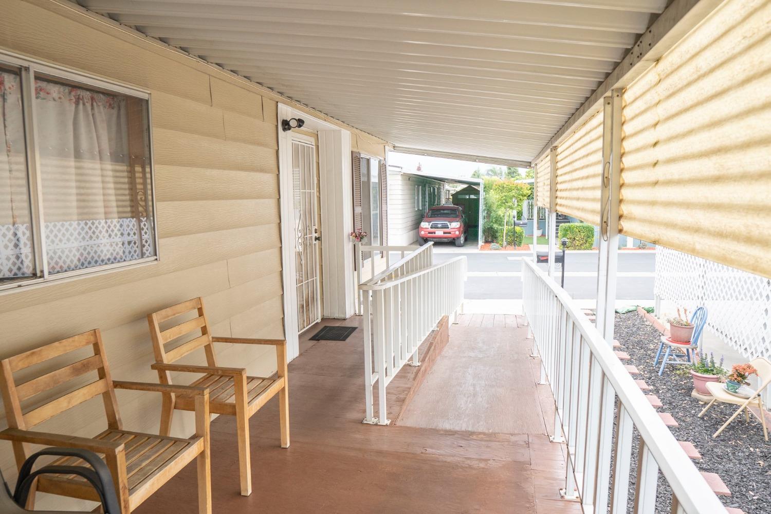 1500 Villa Avenue, Unit 117 Clovis, CA 93612 - Photo 6 of 31 a balcony with table and chairs