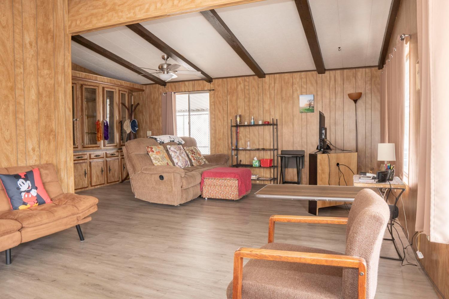 1500 Villa Avenue, Unit 117 Clovis, CA 93612 - Photo 7 of 31 a living room with furniture and wooden floor