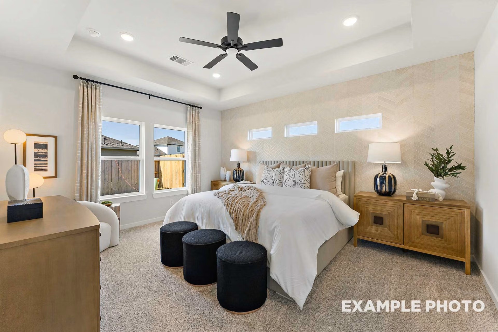 71 Leon Way Dayton, TX 77535 - Photo 11 of 25 a bedroom with a large bed and a chandelier