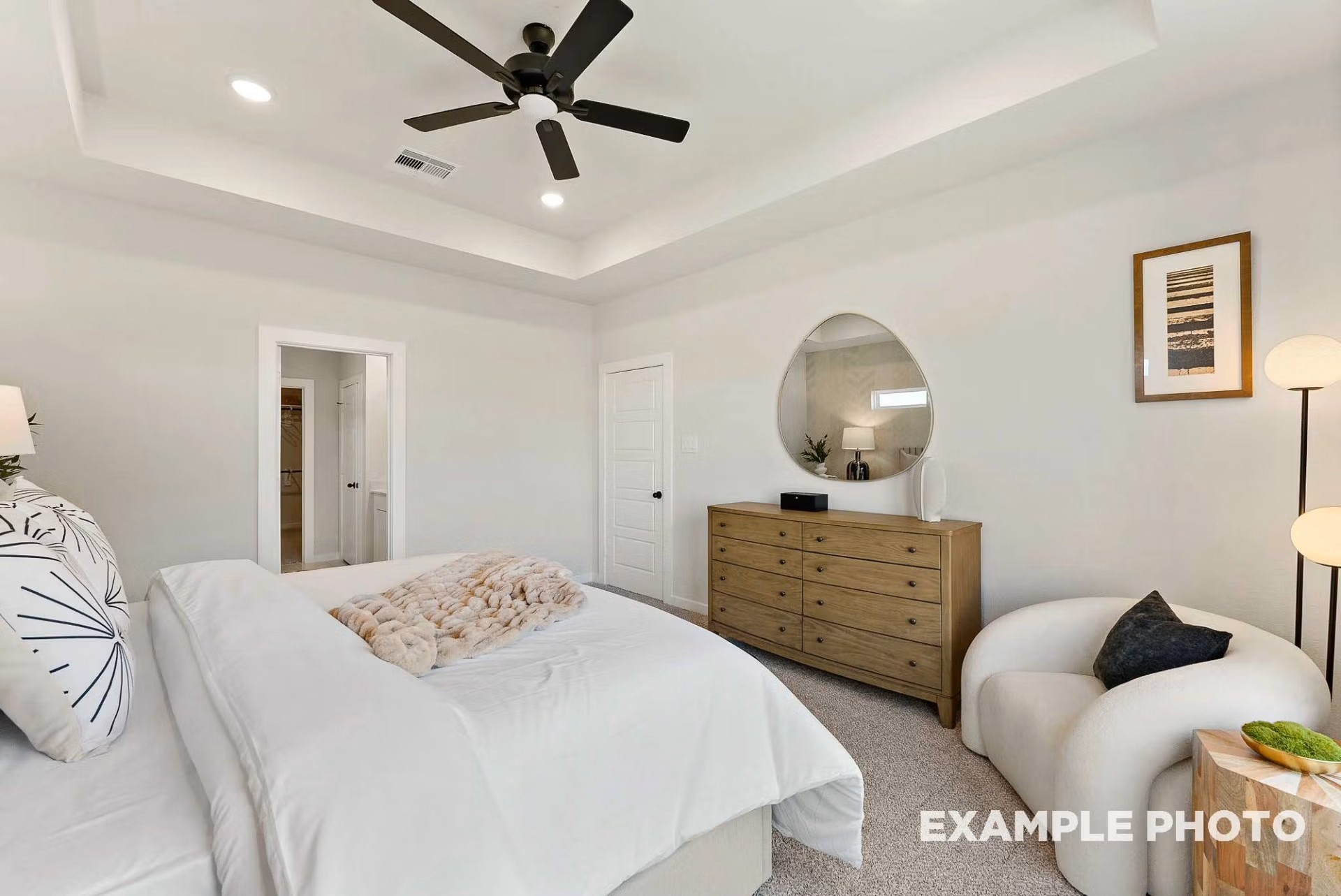 71 Leon Way Dayton, TX 77535 - Photo 12 of 25 a bedroom with a bed and cabinets