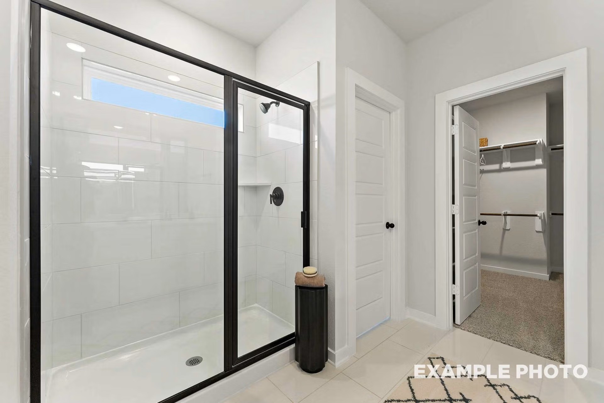 71 Leon Way Dayton, TX 77535 - Photo 14 of 25 a bathroom with a glass shower door