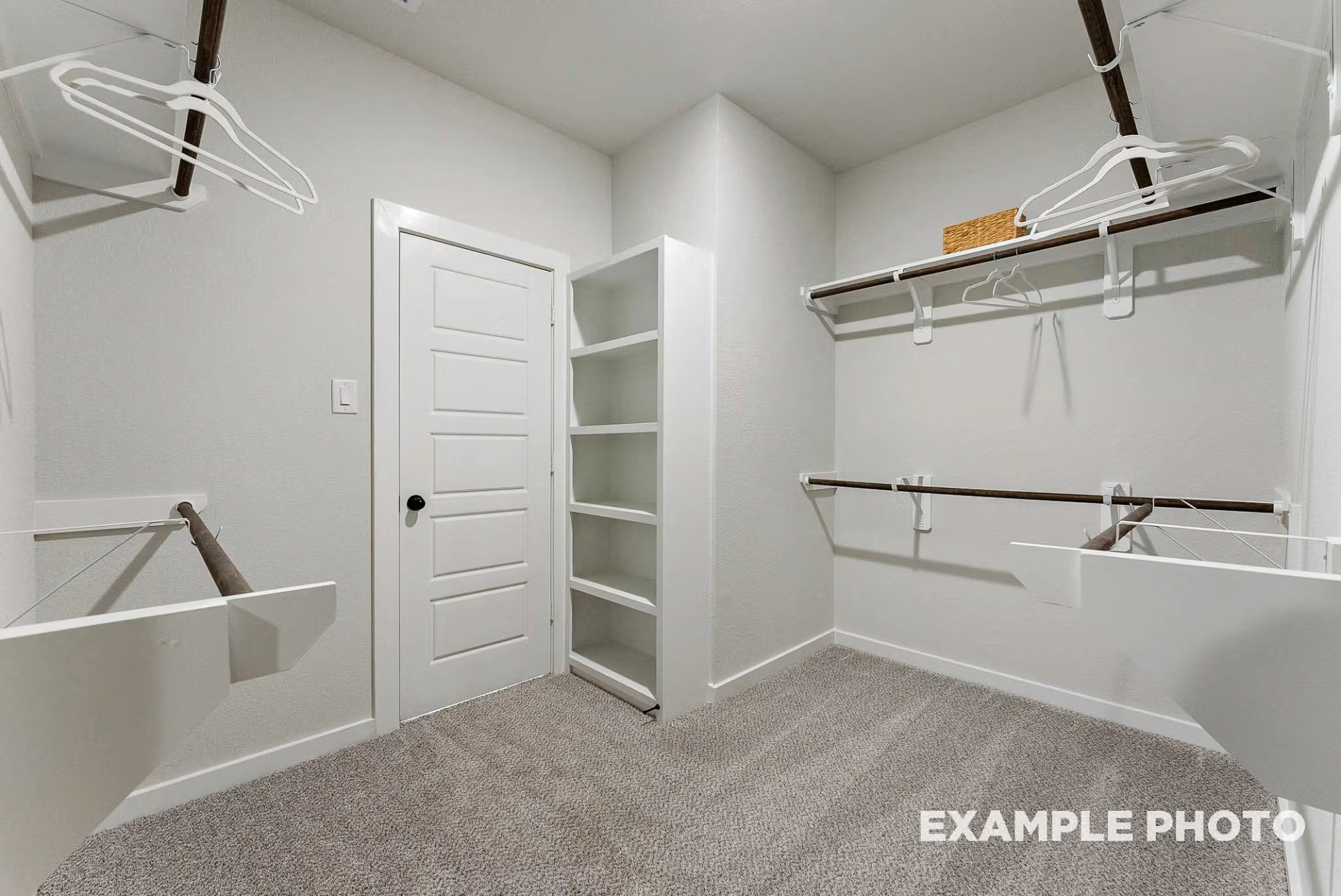 71 Leon Way Dayton, TX 77535 - Photo 15 of 25 a view of walk in closet with empty racks