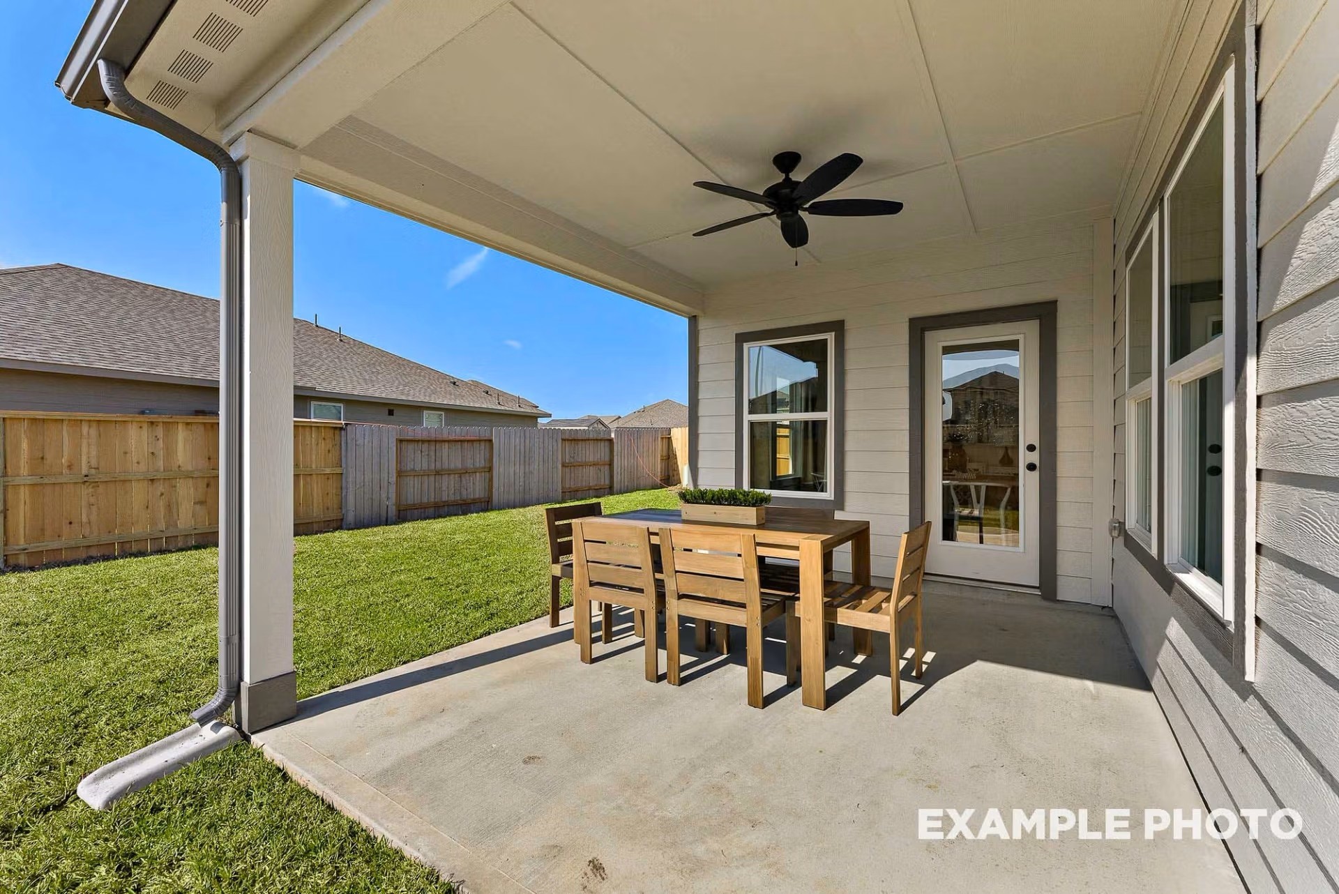 71 Leon Way Dayton, TX 77535 - Photo 23 of 25 a dining room with furniture and a yard