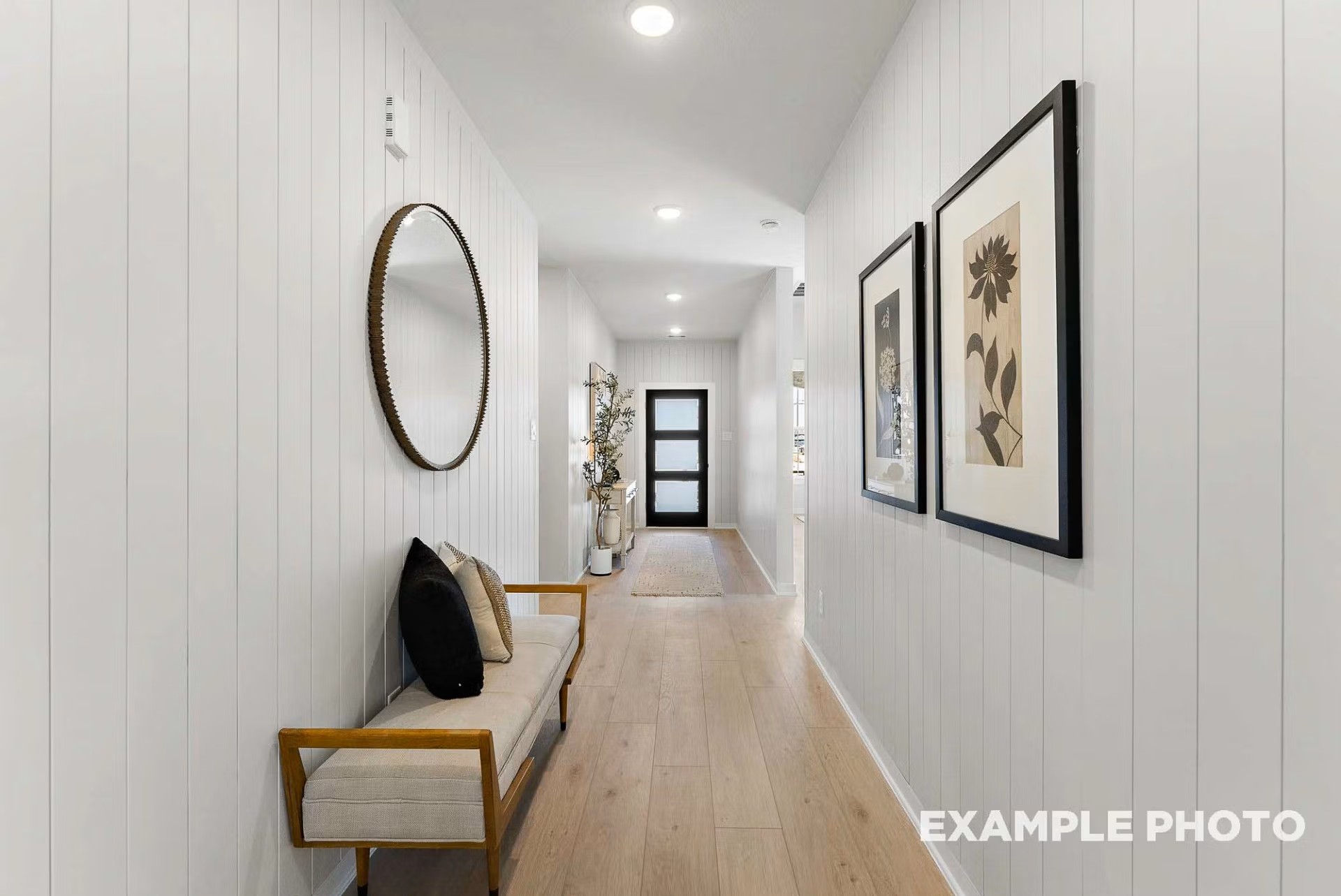 71 Leon Way Dayton, TX 77535 - Photo 3 of 25 a view of a hallway with paintings on the wall