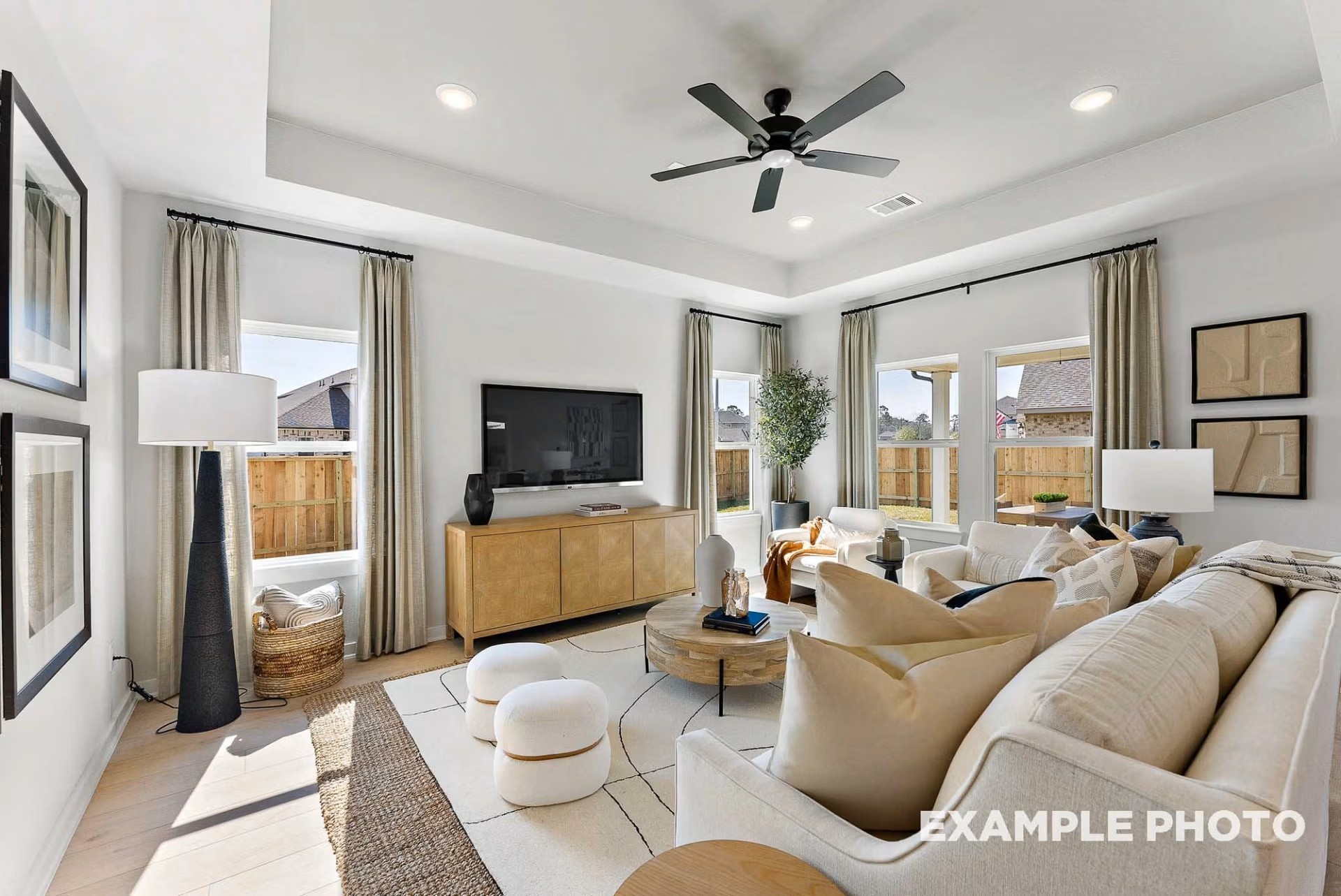 71 Leon Way Dayton, TX 77535 - Photo 7 of 25 a living room with furniture and a flat screen tv
