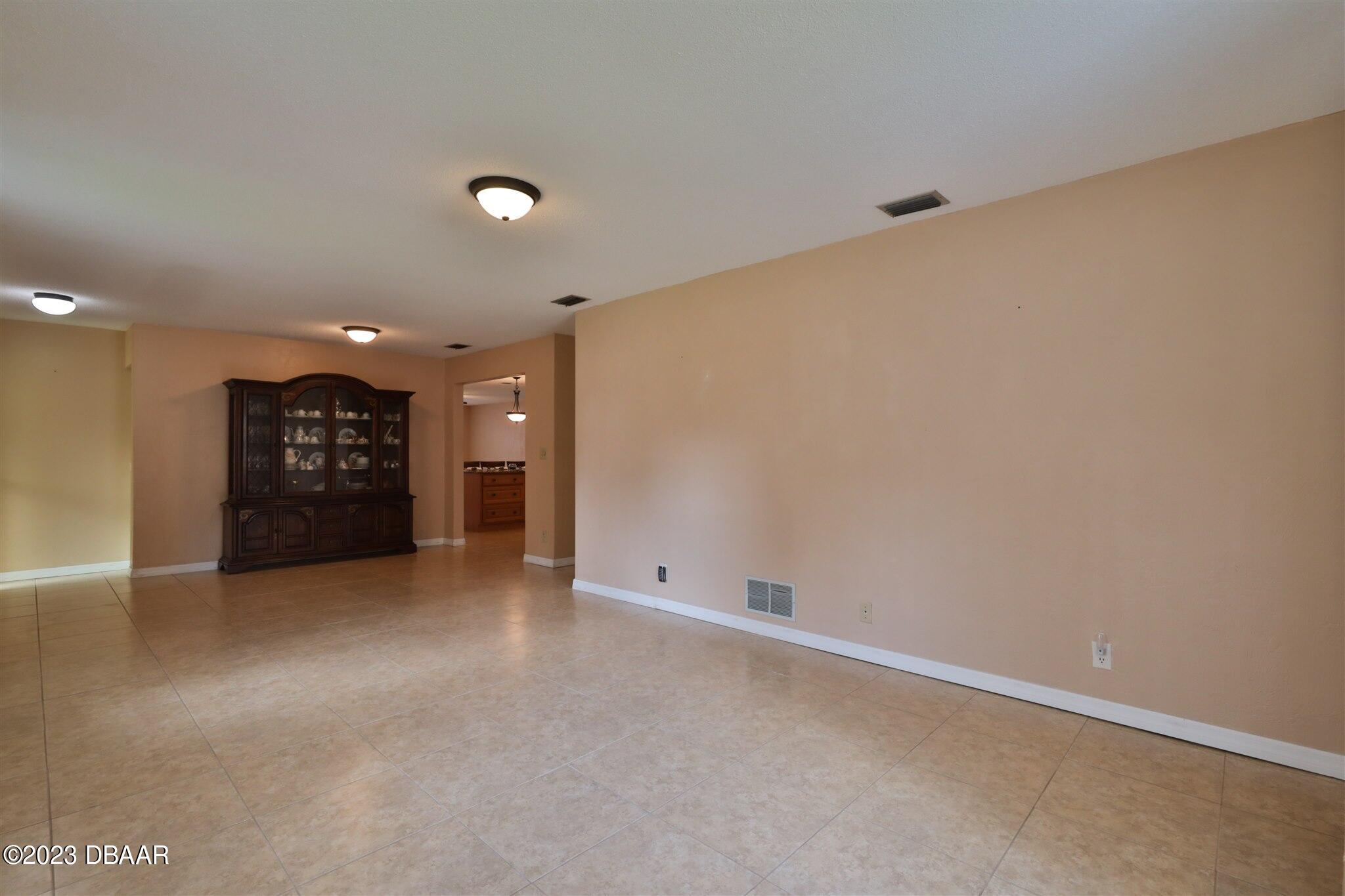 940 Northbrook Drive Ormond Beach, FL 32174 - Photo 7 of 28 an empty room with a bathroom