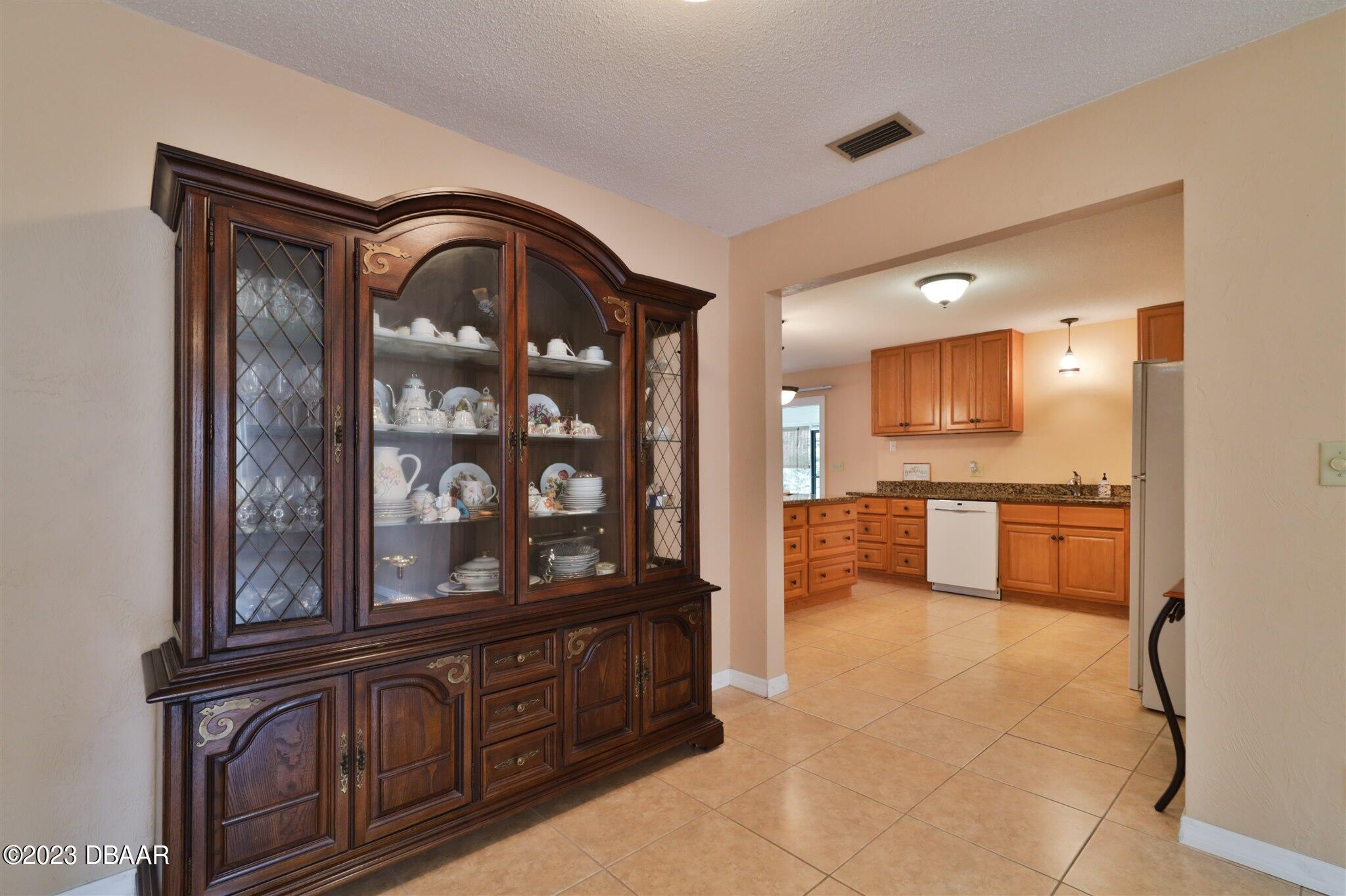 940 Northbrook Drive Ormond Beach, FL 32174 - Photo 8 of 28 a view of a kitchen with a sink and a large window
